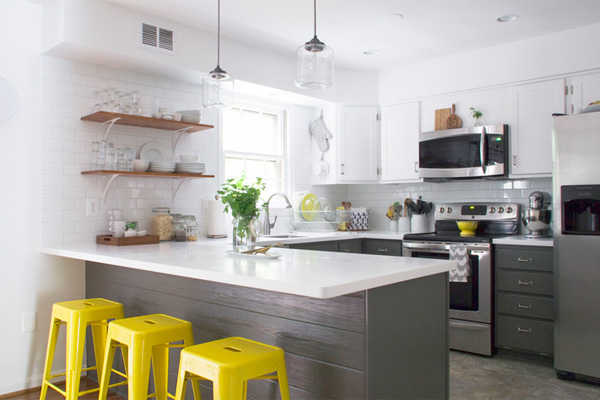 Grey kitchen with yellow bar stools