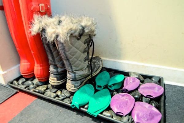 River rocks in a boot tray for wet winter boots