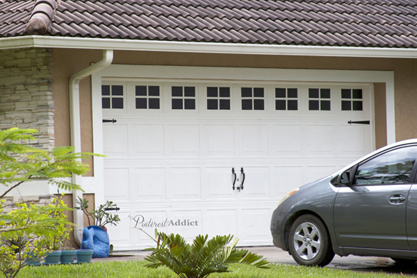 A garage door painted to look like it has carriage details