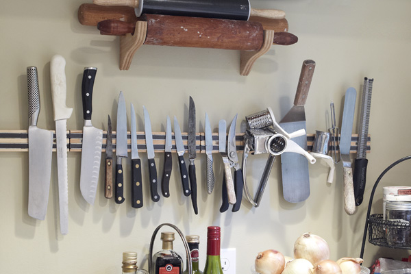 Knives in Plummer's home kitchen on a magnetic strip