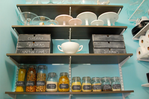 Adjustable shelving” /></p> <p><br /></p> <p><br /></p> <p>Ever penny-wise, Dina bought all the shelving components ($763) during an 30% off sale at the Container Store. She chose attractive, solid shelves for the “first impression” wall opposite the entry door. She also used shelf separators to define space for her muffin tins and baking sheets.<br /><br /><b>New Home For The Mixer</b><br /><br />Dina was obsessed with finding a functional home for her huge mixer. So, she carved out a niche in her pantry for a rolling cart. The cart ($210) has become her all-purpose baking station, with mixer, flour, sugar, and other essentials always at hand.<br /><br />When Dina feels a cookie-baking urge coming on, she only has to pull the cart into the <a class=