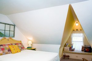 Window seat in attic bedroom