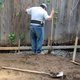 Man working on exterior French drain
