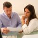 Couple reviewing Emergency Homeowners Loan Program paperwork