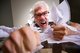 Upset man clutching paperwork