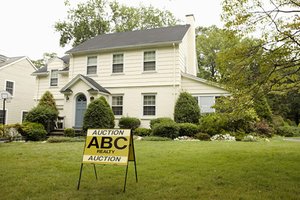 Sign in front of house up for auction