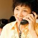 Woman reviewing house offer over the phone