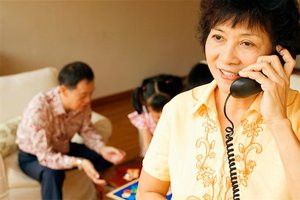 Woman reviewing house offer over the phone