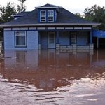 flood-waters-around-blue-house-fema Flood waters surrounding blue house