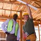 Employees from a design-build firm at a home addition