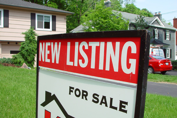 For sales sign in home's front yard