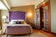 Purple bed in bedroom