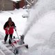 Person using a snow blower at home