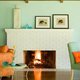 Wall color contrasts with this white-painted fireplace