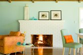 Wall color contrasts with this white-painted fireplace