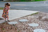 Homemade stepping stones in a home's yard
