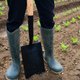 man-in-boots-starting-community-garden Involve volunteers in the decision process