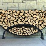 Metal firewood rack outside house