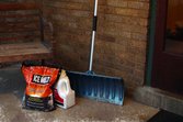 salt-ice-winter-maintenance Snow de-icer on a porch