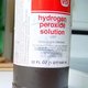 Bottle of hydrogen peroxide in a cabinet