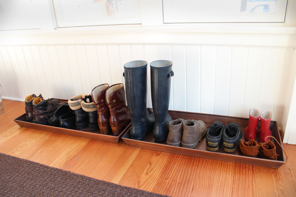 Winter boot drying rack in a home entryway